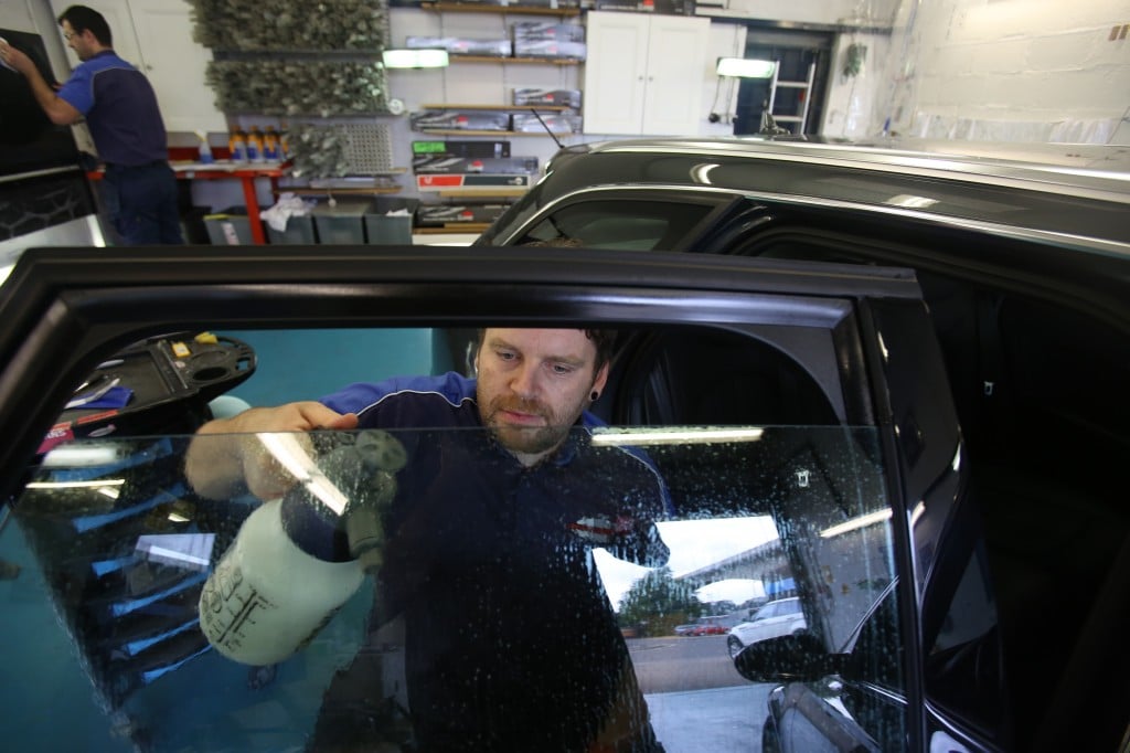 SC Tints busy preparing a car for the hot summer